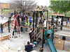 Community building effort with lots of play equipment and tools